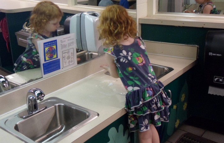 Girl washing hands
