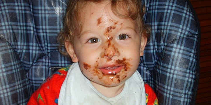 Toddler with food on face