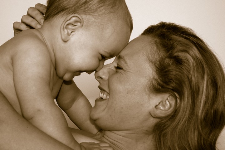 Woman and baby smiling at each other